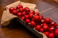 Basket of Red Christmas Ornaments on Table