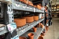variety of clay flower pots with price tags on the shelves in a garden store