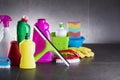 Variety cleaning products on gray background. Royalty Free Stock Photo