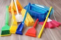 a variety of cleaning supplies, from mops and brooms to sprays and dusters
