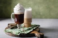 Variety of coffee drinks on green background, Irish coffee