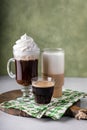 Variety of coffee drinks on green background, Irish coffee