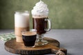 Variety of coffee drinks on green background, Irish coffee