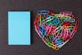 Variety of color paper clips arranged in heart shape Royalty Free Stock Photo