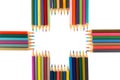 Variety of colored pencils arranged as a Plus sign, isolated on