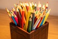 Variety of colored sharpened pencils standing upright in a box Royalty Free Stock Photo