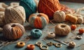 A variety of colored yarn is laid out on a table, including orange, blue, and brown. Royalty Free Stock Photo