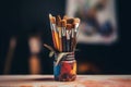 Variety of colorful artist brushes in a jar. AI-generated.