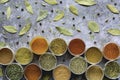 Variety of colorful herbs and spices in cups. Top view