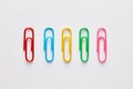 Variety of colorful paper clips in a row Royalty Free Stock Photo