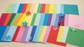 A variety of colorful paper sheets are neatly arranged on a light Royalty Free Stock Photo