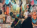 Variety of colorful rugs, tapestries and lady bags for sale at the Vakil Bazaar. Shiraz, Iran.