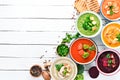 Variety of colorful vegetables cream soups. Concept of healthy eating or vegetarian food. Top view.