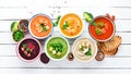 Variety of colorful vegetables cream soups. Concept of healthy eating or vegetarian food. Top view