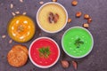 Variety of colorful vegetables cream soups and ingredients for soup. Top view. Concept of healthy eating or vegetarian food Royalty Free Stock Photo