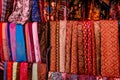 A variety of coloured cloths and silks from Asia