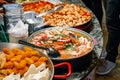 Variety of cooked Chinese food on display for takeaway at Camden Market Royalty Free Stock Photo