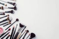 A collection of makeup brushes and tools arranged on a white surface Royalty Free Stock Photo