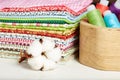 Variety of cotton textiles, cotton flower and wooden box with thread