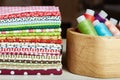 Variety of cotton textiles and wooden box with thread