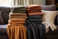 variety of cozy cashmere throws on a couch