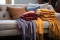 variety of cozy cashmere throws on a couch