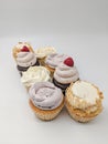 Variety of cupcakes on white background