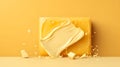 Variety of dairy products on yellow background. Bricks of melted creamy cheese and butter isolated on yellow background with copy