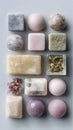 Variety of decorative soaps and natural elements on gray background Royalty Free Stock Photo