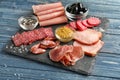 Variety of delicious deli meats on slate plate Royalty Free Stock Photo