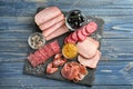 Variety of delicious deli meats on slate plate Royalty Free Stock Photo