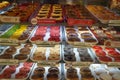 Variety of delicious donut in showcase on display at bakery cake shop Krispy Kreme. Various donuts type on shelf in Bakery shop.