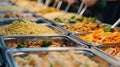 A variety of delicious, freshly prepared pasta and stir-fry dishes displayed in a buffet setting.