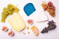 Variety of different cheese with nuts on the table