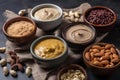 Processing nuts into vegan sauces and cheeses A variety of different foods are on a table. AI generation