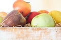 A variety of different fruits in a wooden box close up Royalty Free Stock Photo