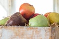 A variety of different fruits in a wooden box close up Royalty Free Stock Photo