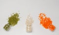 Variety of dry cereals for vegetarians in glass jars: green and orange lentils, white beans on a white background. Copy space