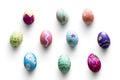 A variety easter painted eggs on background.