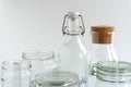 A variety of empty glass jars and bottles at white monochrome background. Zero waste concept. Royalty Free Stock Photo