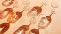 Variety of Empty Glasses on peach Background with shadows