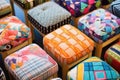 a variety of finished footstools displayed in patterns Royalty Free Stock Photo