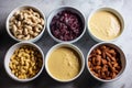 Processing nuts into vegan sauces and cheeses A variety of foods are displayed on a table. AI generation