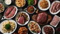 A variety of foods on plates, including meat, vegetables, and pasta