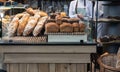 Variety of fresh baked artisan bread on a shelf in bakery shop. Gourmet breads for sale Royalty Free Stock Photo