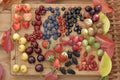 A variety of fresh berries on a wooden background Royalty Free Stock Photo