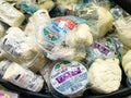 Variety of Fresh Cheeses for Sale at a Grocery Store