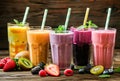 Variety of Fresh Fruit Smoothies Served on a Wooden Table Royalty Free Stock Photo
