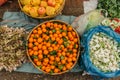 Variety of fresh fruit and vegetable on food market.Basket of tangerines. Garlic, herbs, apples. Mandarin orange with