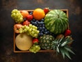 Variety of fresh fruits and berries in wooden box. Healthy vegetarian summer food Royalty Free Stock Photo